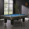 Moderne pooltafel met blauw laken en zwarte houten afwerking in een stijlvol ingerichte ruimte met grote ramen, grijze tegelvloer, een wandklok en een groene kamerplant.
